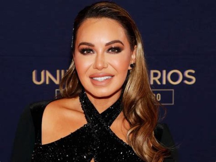 Chiquis Rivera poses showing off her rear in front of the mirror with