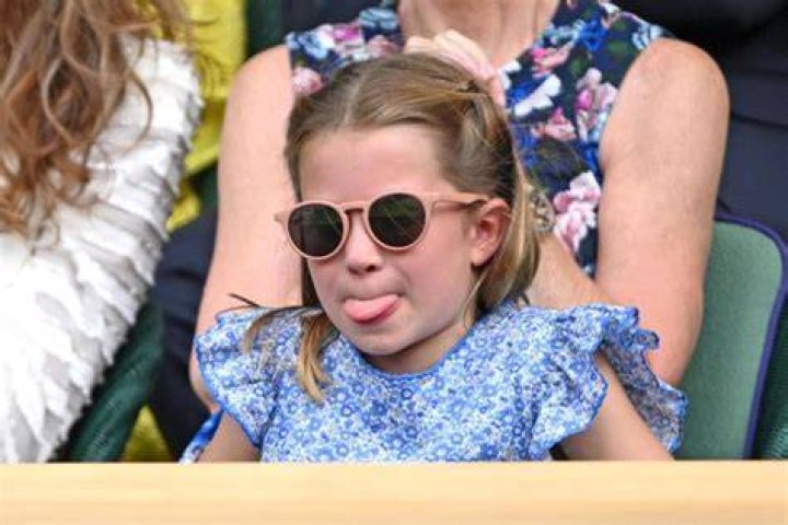 Princess Charlotte, 7, makes funny faces as she joins Prince William